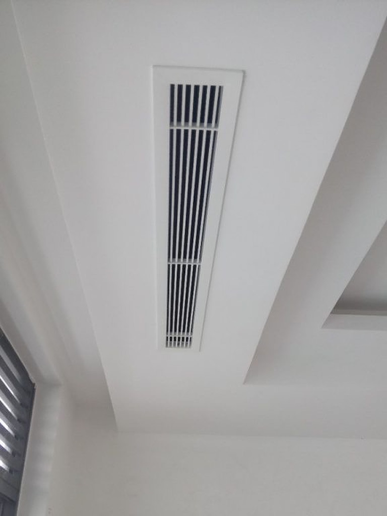 Modern linear vent installed in a white ceiling as part of a ducted air conditioning install by Integrated Trade Services.
